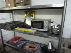 *Contents of the Stainless Steel Shelf Unit Containing Various Stainless Steel Bowls, Saucepans,
