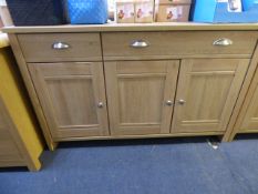 *SIDE BOARD UNIT WITH 2 DRAWERS AND CUPBOARDS IN LIMED OAK FINISH WITH BRUSHED STAINLESS STEEL