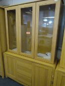 *Glazed Display Unit over Cupboards in Light Wood Finish and Brushed Stainless Steel Handles