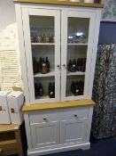 *GLAZED WALL UNIT OVER CUPBOARD IN CREAM AND LIGHT OAK FINISH