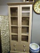 *Glazed Bookcase over Drawers in Limed Oak Finish with Brushed Stainless Steel Handles