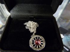 Necklace with Cartwheel Pendant Set with Pink Stone