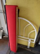 White Metal Bed Head and Red and Black Blind and Pelmet