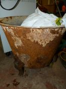 Cast Iron Cauldron on Decorative Feet containing Assorted Working Gloves