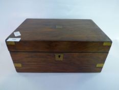 A Walnut Writing Box With Brass Corners