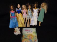 Box containing 6 Barbie Dolls & a Magazine