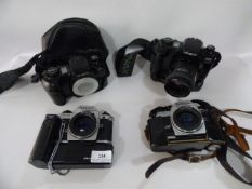 Box containing 2 Nikon & 2 Minolta Camera Bodies