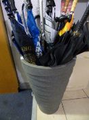 Plastic Planter containing Umbrellas and Walking Sticks