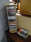 Beech CD Rack containing CDs and Shopping Basket