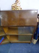 Bureau over Bookshelves enclosed by Sliding Glazed Doors