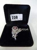 Silver Coloured Necklace with Wheel Charm with Pink Stone