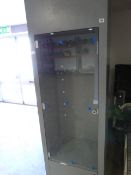Grey Shelving Unit enclosed by Glazed Doors with Storage