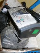 Box Containing Rubber Spacers and a Brother Fax Machine