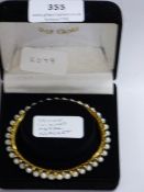 yellow coloured metal bracelet with pearls