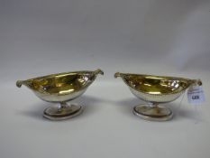 2 x silver salt stands with guilt centres