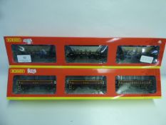 Two sets of three Hornby goods wagons