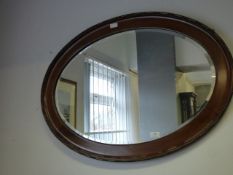 mahogany oval framed mirror
