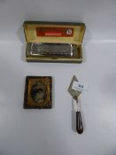 Chromatic Harmonica, miniature trowel and photograph