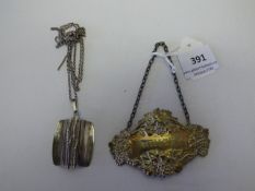 silver whiskey label and 70's necklace