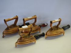 4 copper flat irons with trivets