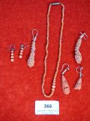 a pair of coral earrings etc