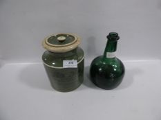 Snuff and tobacco container with green glass musical bottle