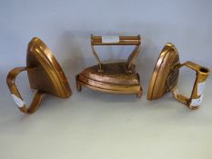 3 flat irons one with trivets