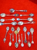 a collection of silver and silver plated souvenir spoons