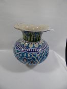 Large blue and white vase at fault