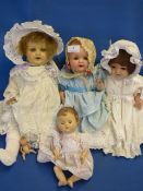 Box containing four porcelain dolls by Amand Marseille and others