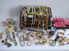 Two trays of assorted costume jewllery and a leather bound jewllery box