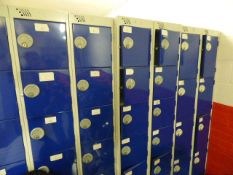 *Three banks of blue and gray lockers