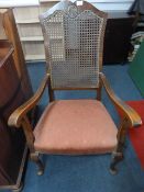 Walnut framed fireside chair with upholstered seat, berege back and cabriole feet