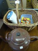 Wicker basket containing pegs and a travel kettle