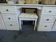 White writing table with upholstered foot stools