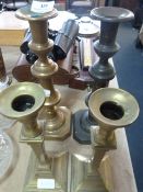 two pairs of brass candle sticks