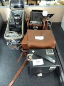 Box brownie camera, cine camera plus others and a tripod