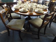 Reproduction mahogany extending circular dinning table with six chairs