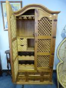 Pine and wrought iron wine rack and bar unit enclosed by lattice doors