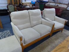 modern three piece suite comprising of; two seat settee matching chair and footstool in light elm
