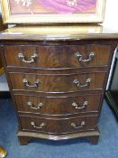 Figured mahogany reproduction chest of four draws on bracket feet