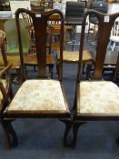 Two high back Edwardian mahogany dining chairs