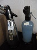 Two soda siphons