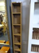 CD storage shelving unit in light oak finish
