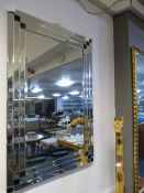 Bevelled glass wall mirror