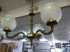 Brass three branch chandelier with frosted glass shades