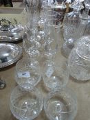 Nine champagne flutes and four brandy glasses