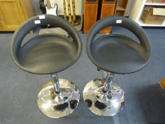*Pair of black and chrome gas lift bar stools