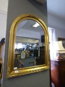 Gilt framed beveled glass arch top mirror