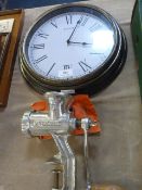 Quartz wall clock and a vintage meat mincer